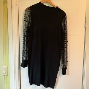Woman’s long sleeve polkadot black dress